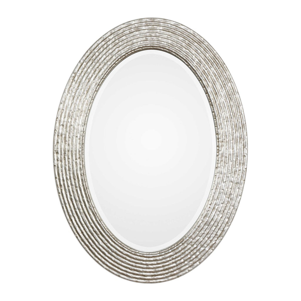 This oval frame features a reeded surface with a hammered texture and a burnished silver wrapped finish. Mirror is beveled and may be hung horizontal or vertical.