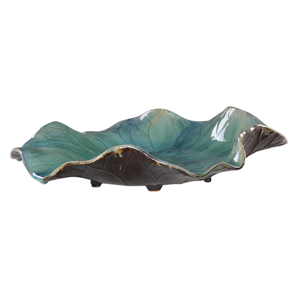 Up close side view of ceramic decor flower in green and brown tones by Uttermost