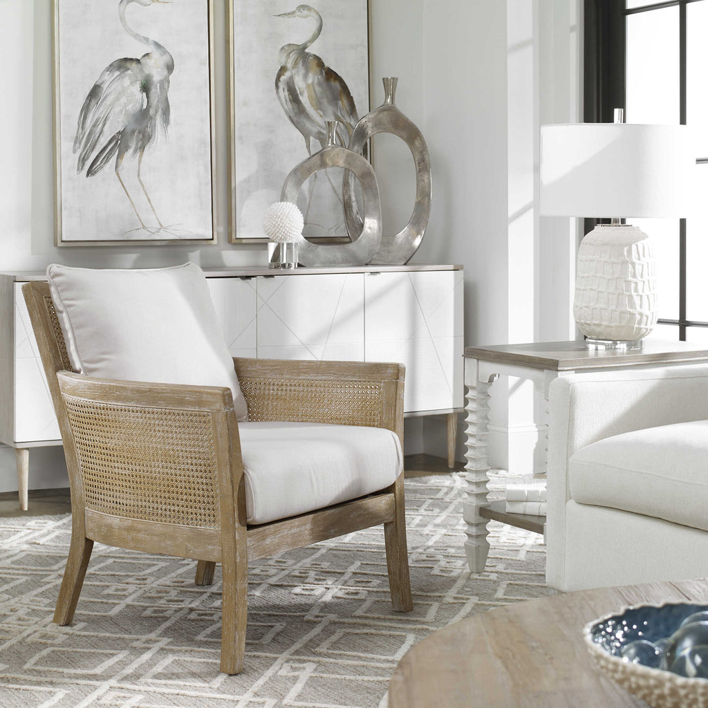 Encore armchair by Uttermost with white fabric in room setting.