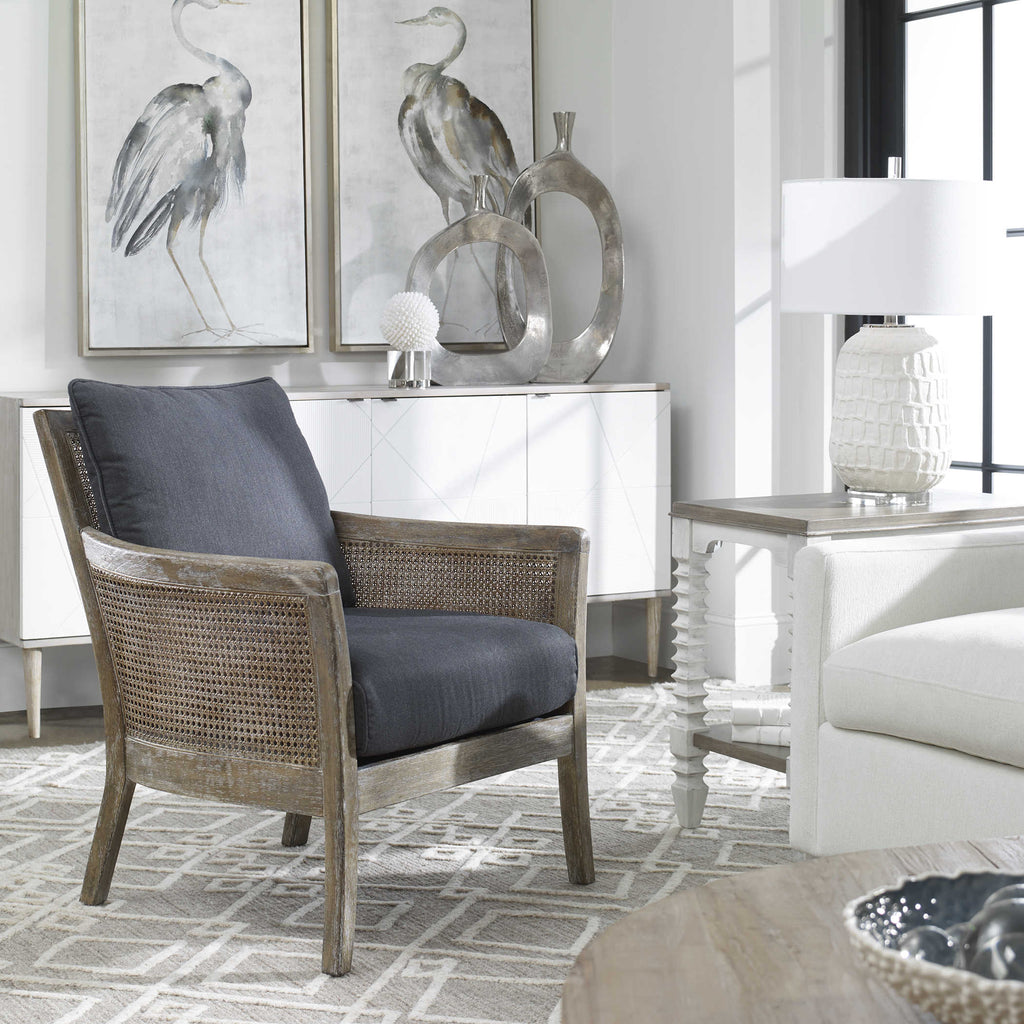Encore armchair by Uttermost with dark gray fabric in room setting.