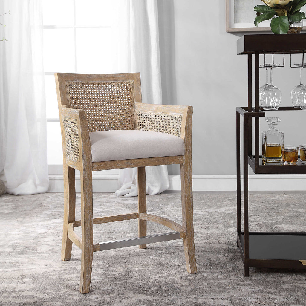 Encore counter stool by Uttermost, natural color with off-white fabric room view. 