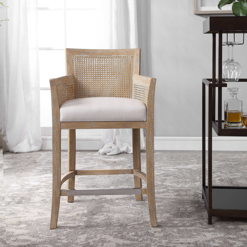 Encore counter stool by Uttermost, natural color with off-white fabric room view.