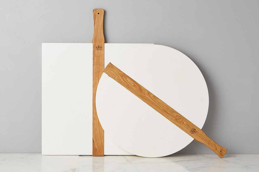 Large White Round Italia Charcuterie Board by etúHOME. Hand-crafted from reclaimed wood, this charcuterie board can also double as a decorative kitchen accent.  Paired with square etúHOME board.