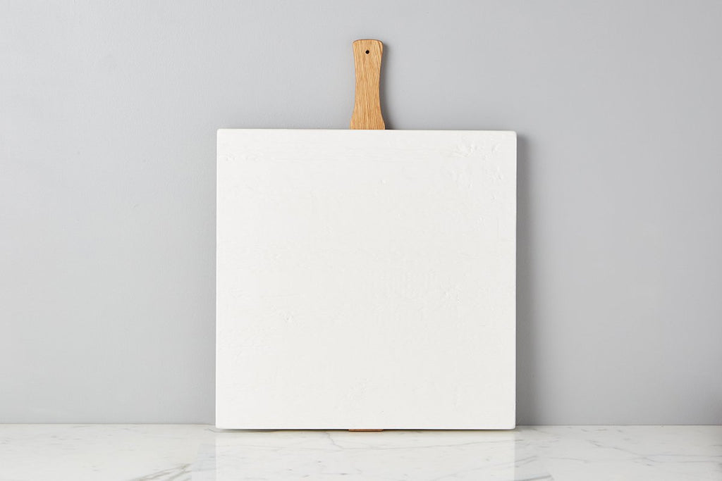 Large or small white square Italian charcuterie board. Hand-crafted from reclaimed wood, this charcuterie board’s modern yet functional design can also double as a decorative kitchen accent. Back detail.